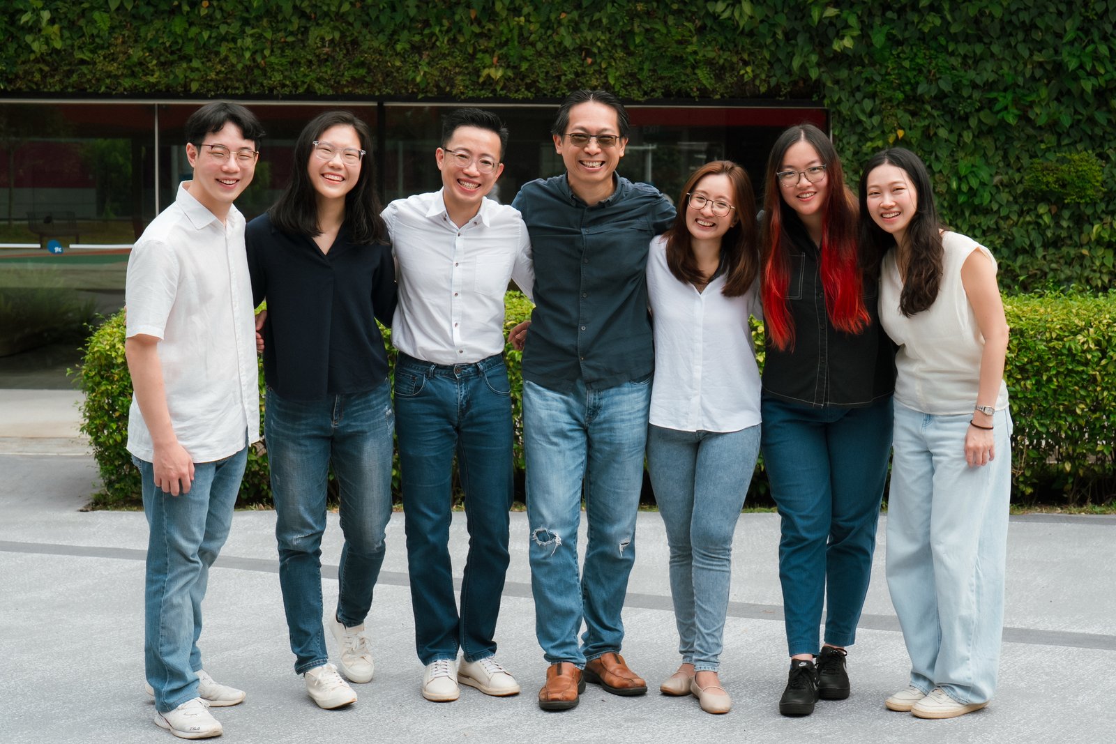 The ImmunoQs team standing together outside the office